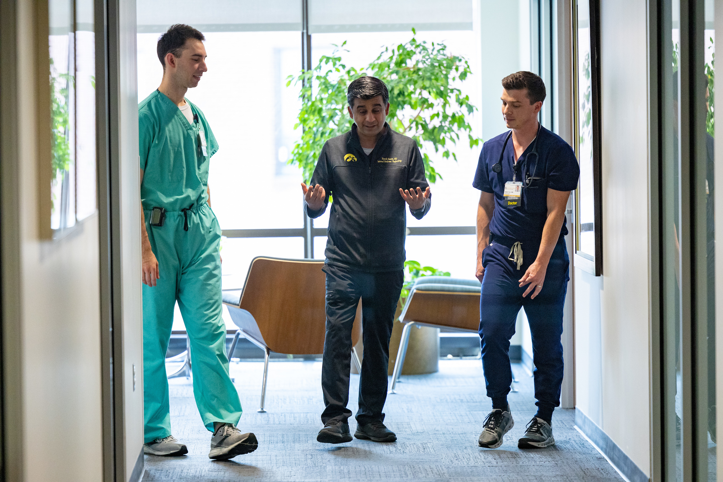Manish Suneja, Director, Internal Medicine Residency Program, on Friday, June 16, 2023. With residents Taylor Cox and Reed Johnson.