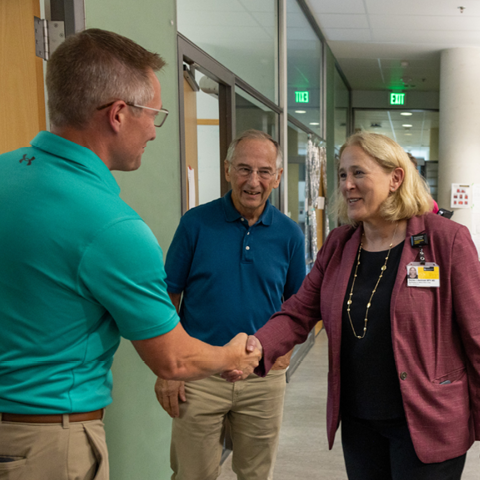 Denise Jamieson greets researchers on a tour of PBDB led by Michael Welsh on Thursday, Aug. 3, 2023.