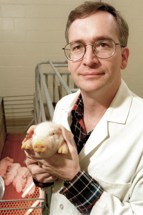 Randy Prather holding pig image