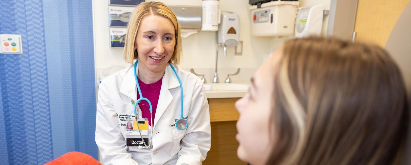 Dr. Lyndsay Harshman with a pediatric kidney transplant patient in the Pediatric Specialty Clinic on Tuesday, Jan. 16, 2024. 