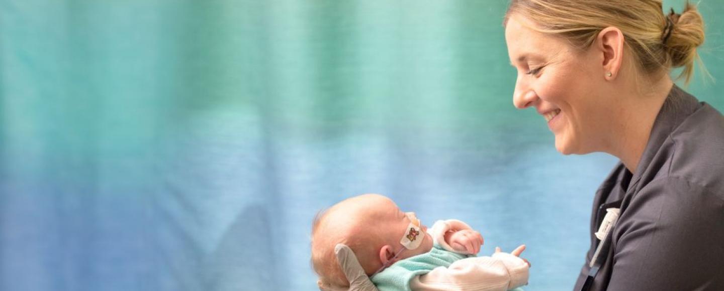 nurse holding baby