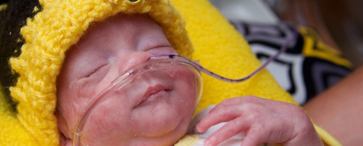 premature baby in a University of Iowa hat
