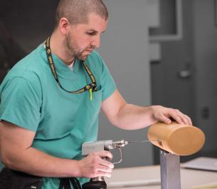 student using an orthopedic simulator