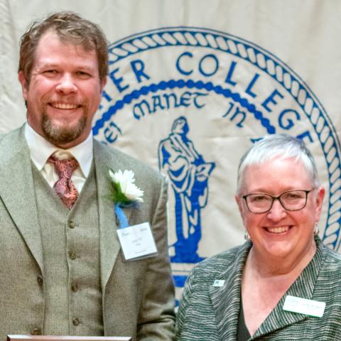 Joshua White, MD receives an award at Luther