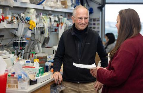 Mike Welsh in lab with student