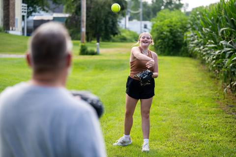 Payten Stout plays catch with family
