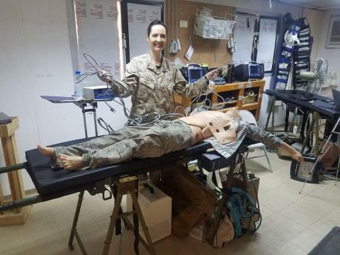 Andrea Austin practicing on a manikins