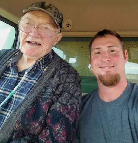 Jacob Pergande with his grandfather, Eldon Pearson, inside their tractor cab on the family farm in north-central Iowa.